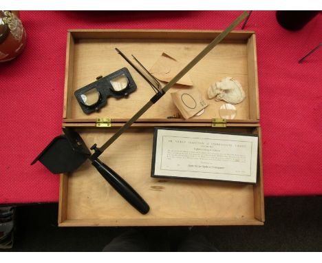 A boxed vintage opticians stereograph with a selection of Dr Wells stereoscopic charts cat no. 1965 eighth enlarged edition p
