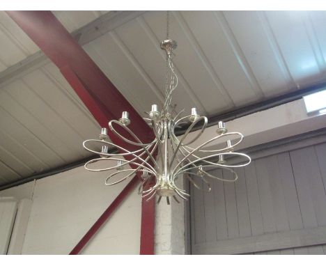 A modern ceiling chandelier with twelve sconces 