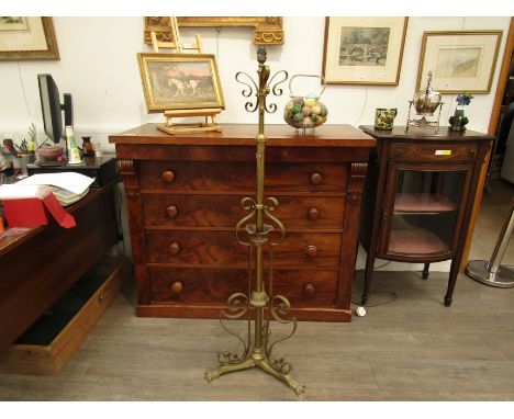 A late 19th Century Arts &amp; Crafts brass and copper telescopic standard lamp on paw feet 