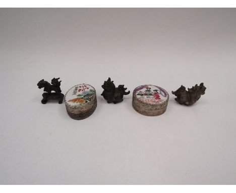A collection of Oriental metal figures and enamel pill boxes 