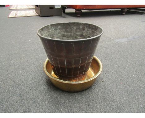 A copper planter of bucket form and an Eastern brass bowl 