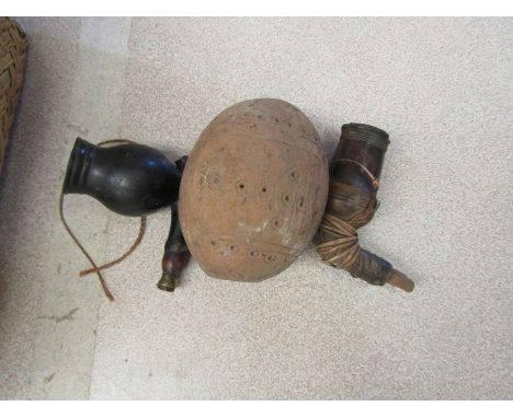 African, possibly Gabonese, pipe bowls together with a decorated seed pod.  (3).  Provenance: Part of a collection of items b