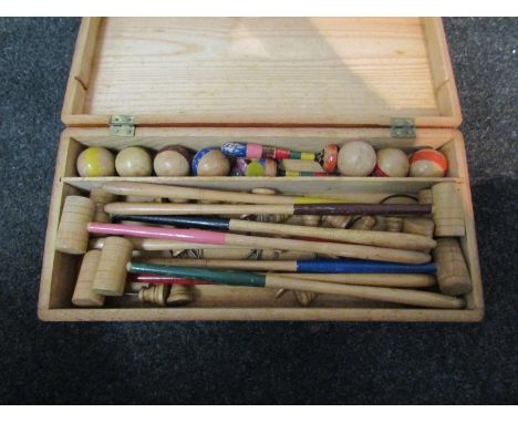 A vintage miniature croquet set 