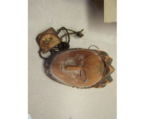An African, possibly Gabonese, small ceremonial carved wooden mask and a small leather pouch with twisted cord strap.  Proven