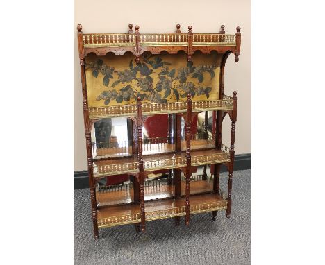 A French early twentieth century mahogany mirrored wall shelf by Alf Giroux, with label verso, width 62cm.