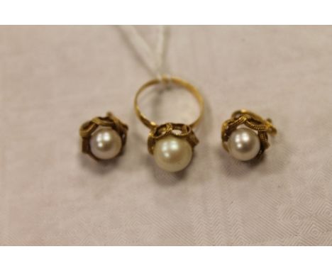 A pair of continental yellow metal pearl earrings, together with the matching faux pearl dress ring. (3) CONDITION REPORT: Nu