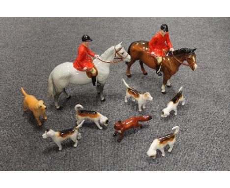 An eight piece Beswick hunting set, together with a labrador of the same manufacture. (9) CONDITION REPORT: Good conditions.