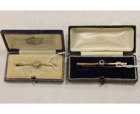 An Edwardian seed pearl bar brooch set with a diamond, together with a 9ct gold bar brooch. (2) CONDITION REPORT: Good condit