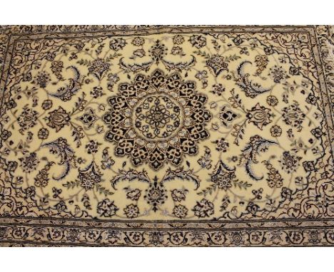 An Iranian wool carpet, on cream ground, 173 cm x 76 cm.