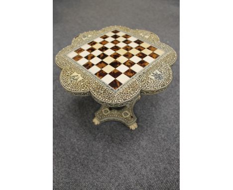 A fine nineteenth century Vizagapatam ivory and tortoiseshell chess table, height 22 cm. CONDITION REPORT: Mostly condition i