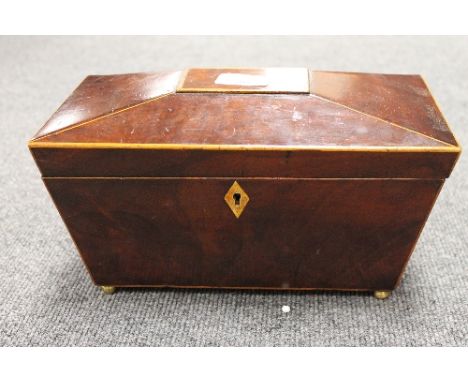 A nineteenth century inlaid mahogany tea caddy, on brass ball feet, with 28 cm. CONDITION REPORT: Sadly missing internal line