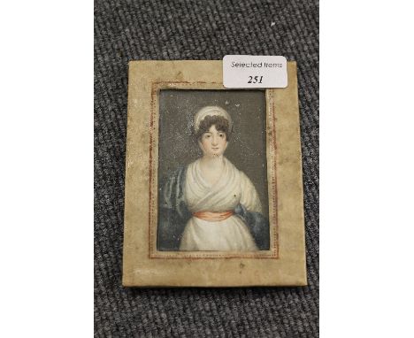 A portrait miniature depicting a lady wearing a blue shawl, 6.5 cm x 9.5 cm, framed. CONDITION REPORT: Un examined out of the