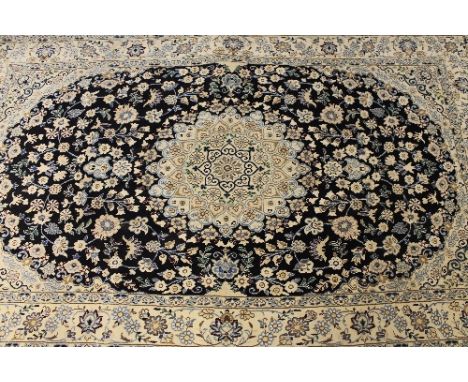 An Iranian wool carpet, on cream ground, 204 cm x 125 cm.