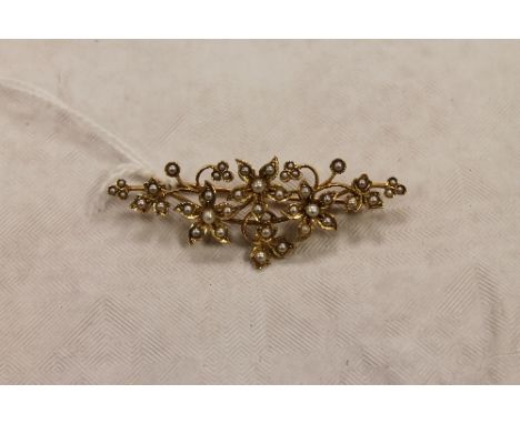 A 15ct gold seed pearl floral brooch, width 5.5 cm, 6g. CONDITION REPORT: Good condition.
