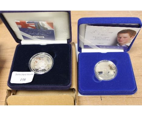 A Royal Mint twenty first birthday five pound silver crown, Prince Henry of Wales, together with a silver proof crown, entent