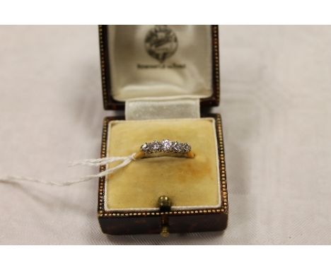 A five stone diamond ring mounted in yellow metal. CONDITION REPORT: The shank hallmarks rubbed.