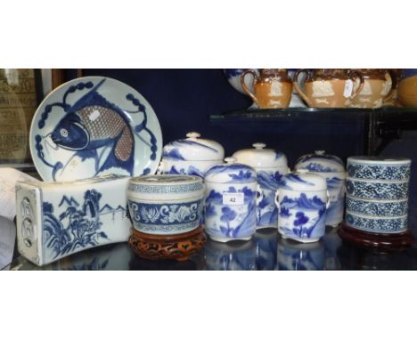 A SET OF FIVE ORIENTAL BLUE AND WHITE DECORATED STORAGE JARS, an Oriental ceramic pillow and similar ceramics