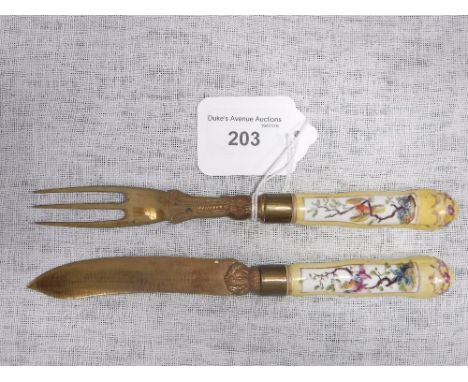 A 19TH CENTURY  CONTINENTAL PORCELAIN HANDLED KNIFE AND FORK with gilt blades and yellow ground handles 