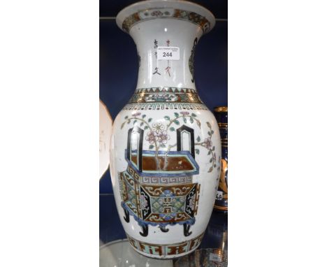 A CHINESE BOTTLE VASE decorated with calligraphy and flowers in vases