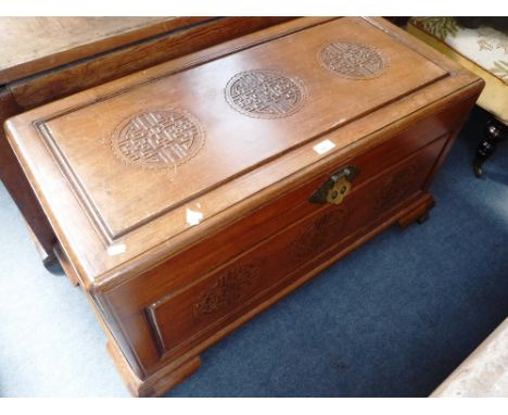 AN ORIENTAL CARVED CAMPHOR WOOD TRUNK, 38" wide