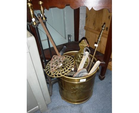 A BRASS COAL BUCKET, a trivet, fire tools and similar items