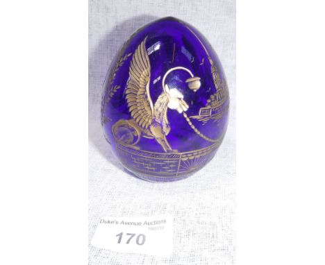 A SOUVENIR FABERGÉ BLUE GLASS EGG, with gilt decorated cut decoration 