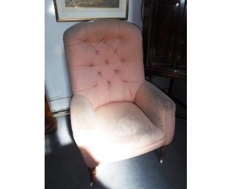 A VICTORIAN BUTTON-BACK CHAIR, upholstered in pink material 