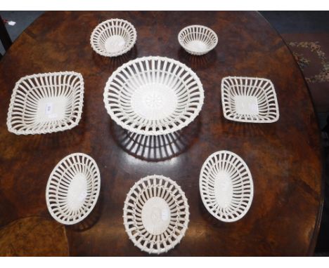 A COLLECTION OF CREAMWARE CERAMIC BASKETS