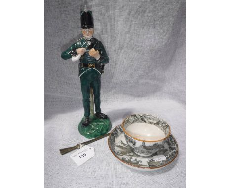 A COPELAND CERAMIC FIGURE OF A 95TH RIFLEMAN and a tea bowl with saucer