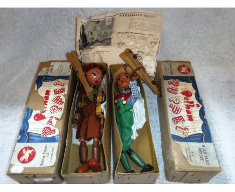 A PELHAM PUPPET OF A COWGIRL, in original card box and one other of Hansel also in original card box