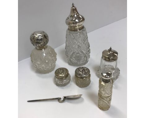 A collection of six various dressing table jars / bottles with silver mounts including a hobnail cut example with stopper and