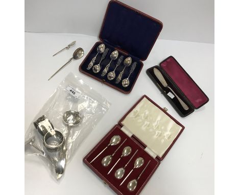 A collection of small silver wares to include sauce ladle, baby pusher, butter knife with openwork handle, two napkin rings, 