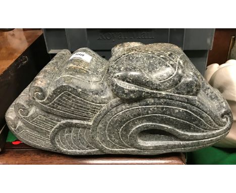 A carved polyphant stone dragon head in the Maori or Polynesian style by Sheila Mead, signed with initial "M" to base, 39 cm 