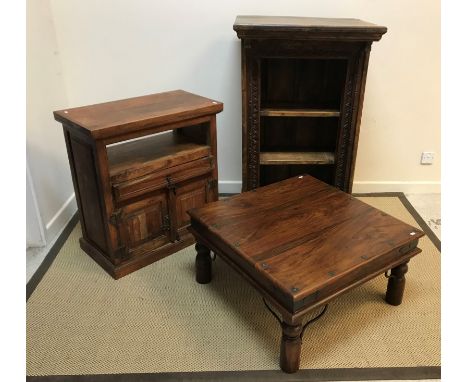 An Indian carved teak open shelf unit on plinth base, 76 cm wide x 52 cm deep x 121.5 cm high, an Indian hardwood side cabine