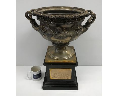 An Edwardian silver Warwick vase after the antique (by Edward Barnard &amp; Sons, London 1909), bearing armorial depicting an