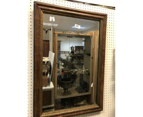 An 18th Century walnut and gilt framed rectangular wall mirror of plain form with Vauxhall plate, 50 cm x 71 cm