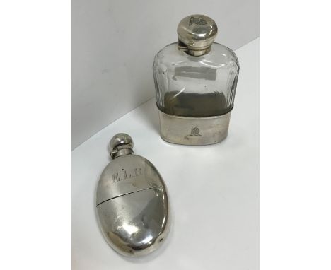 A Victorian silver hip flask of oval form with integral cup, bearing initials "E.L.R." (by Frederick Bradford Macrea for The 