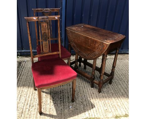 An early 20th Century mahogany display cabinet with figured arch panelled central door flanked by two glazed doors and side p