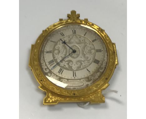 A 19th Century Gothic Revival style engraved brass cased bedside clock in the manner of Thomas Cole, the silvered and engrave