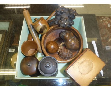 A quantity of various treen ware to include carved beetelnut egg-shaped pomander, small dried gourd as an apple with penwork 