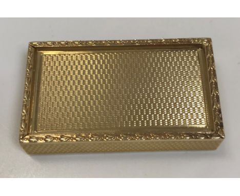 A 9 carat gold engine turned snuff box with sliding top and harebell banded edge by S.J. Rose &amp; Son of London 27.5 g 4.5 