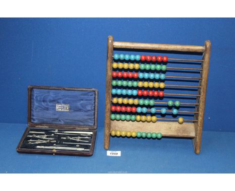 A British made complete box set of Drawing instruments by Holden in a fitted case and a vintage English Abacus.