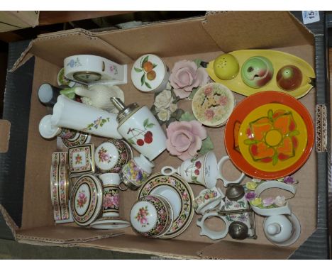 A quantity of china ornaments including Wedgwood, 'Clio' dressing table set, clocks, bells, roses, Carlton ware cruet set etc