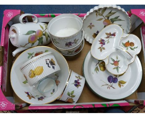 A quantity of Royal Worcester 'Evesham' china having gold and green rims to include; coffee pot, souffle dishes, flan dish, e