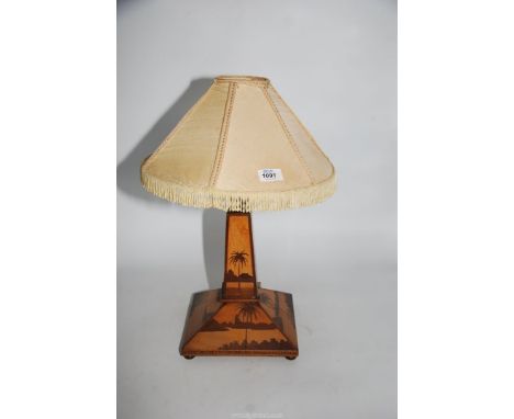 A vintage Treen table lamp with square base and tapering column with palm tree and lake marquetry scenes, 18'' tall including