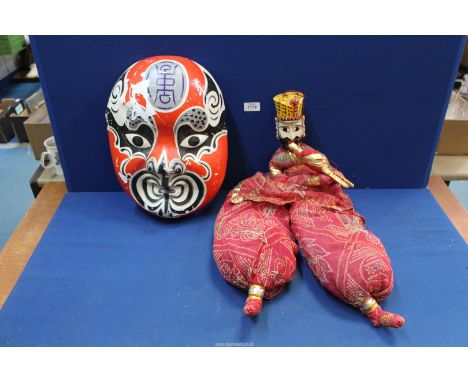 A Tourist piece face mask and puppet.