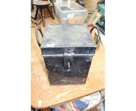 A large black metal Trunk with two elongated carrying handles, 14" tall x 11" square.