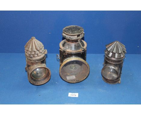 A black finished signalling Lamp with rotating clear, green and red light filters and hook bracket by Hiatt & Co., Birmingham