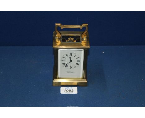 A Brass Carriage Clock by Garrard & Co, 112 Regent Street W1, with key.
