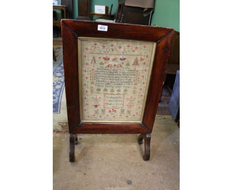 A Sampler worked by Caroline Butler, aged 12 years 1839, 12 1/2" x 16 1/2" mounted in firescreen, 18" x 29" high overall.